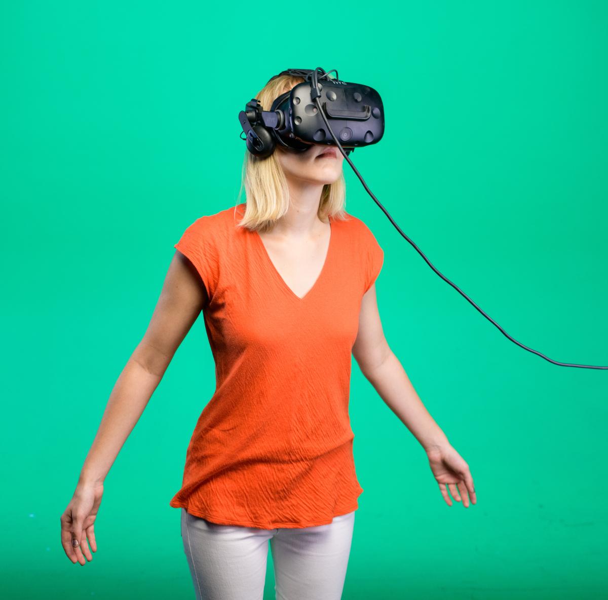 A woman wearing VR glasses.